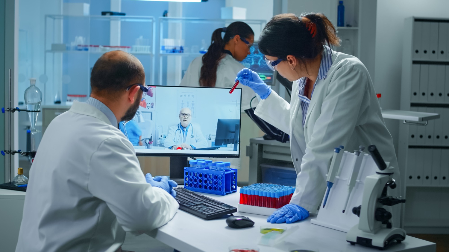 Laboratory technicians working with diagnostic test equipment