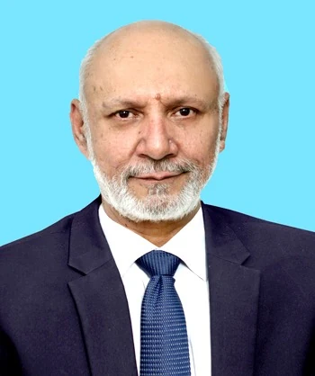 Dr. Muhammad Atif Malik, consultant psychiatrist at MD Health Center Lahore, wearing a dark suit, white shirt and blue tie