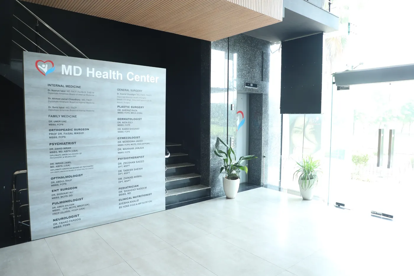 Interior lobby and medical directory signage at MD Health Center in DHA Raya, Phase 6, Lahore